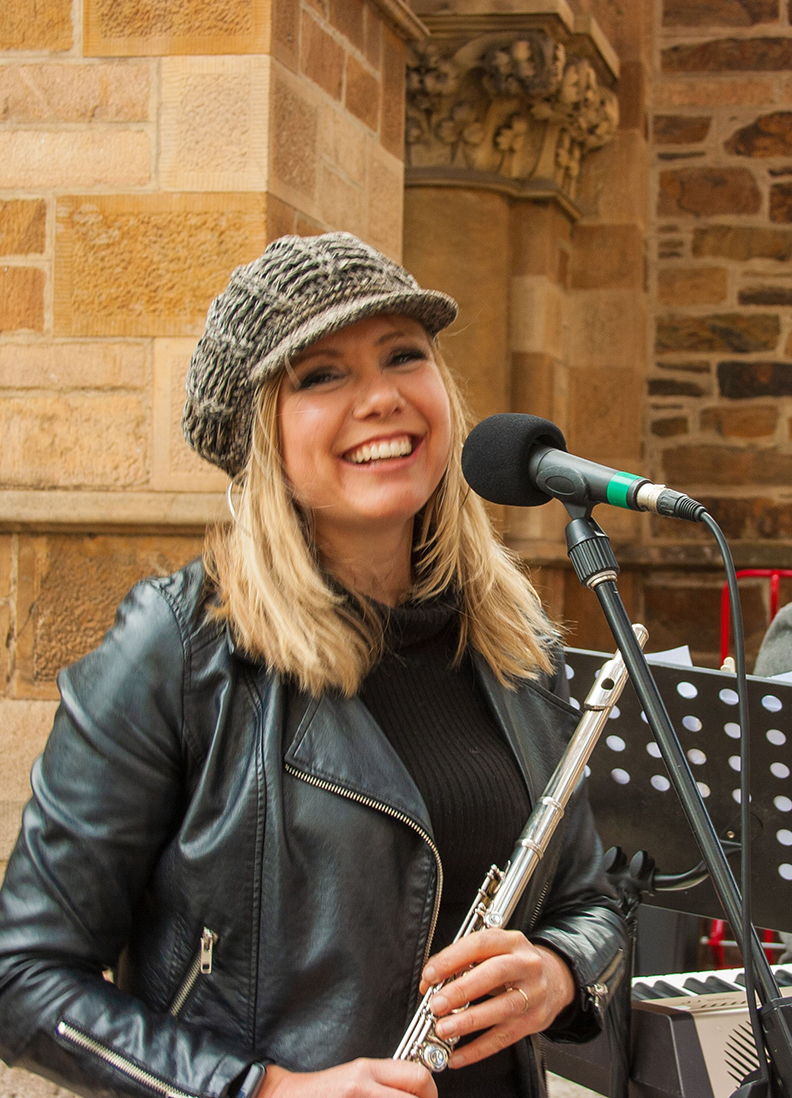 Woman singing into microphone