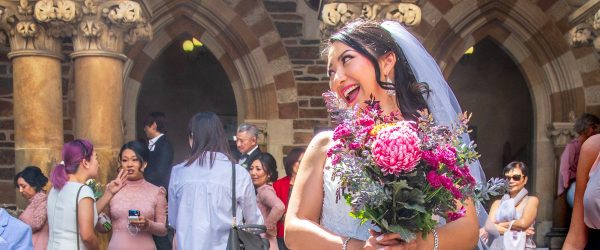 Bride smiling in front of church