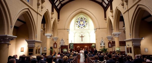 People inside church attending wedding